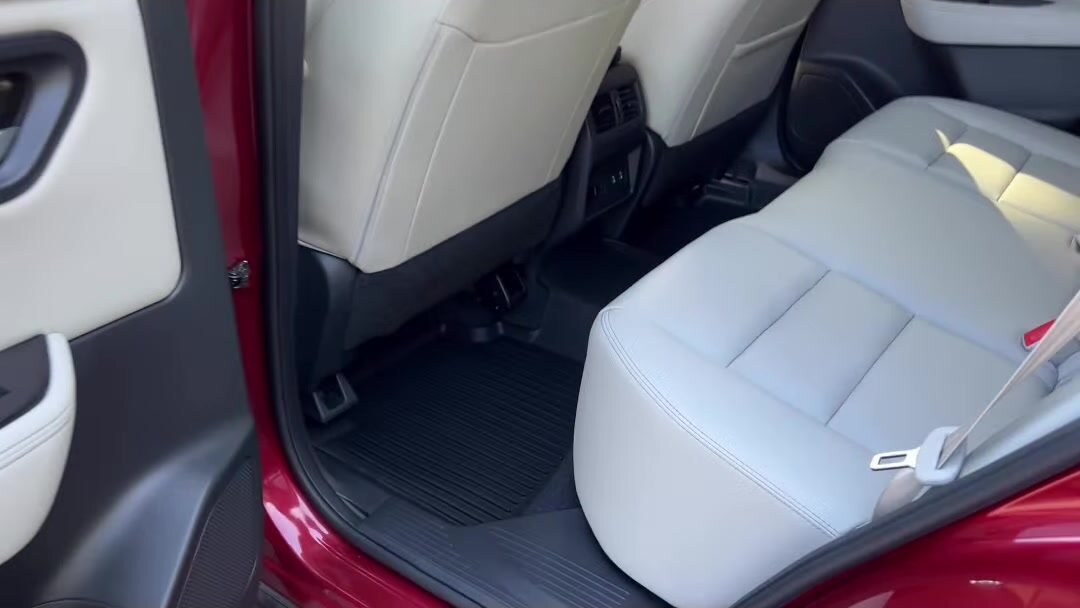 Light grey rear seats and floor after an interior detail
